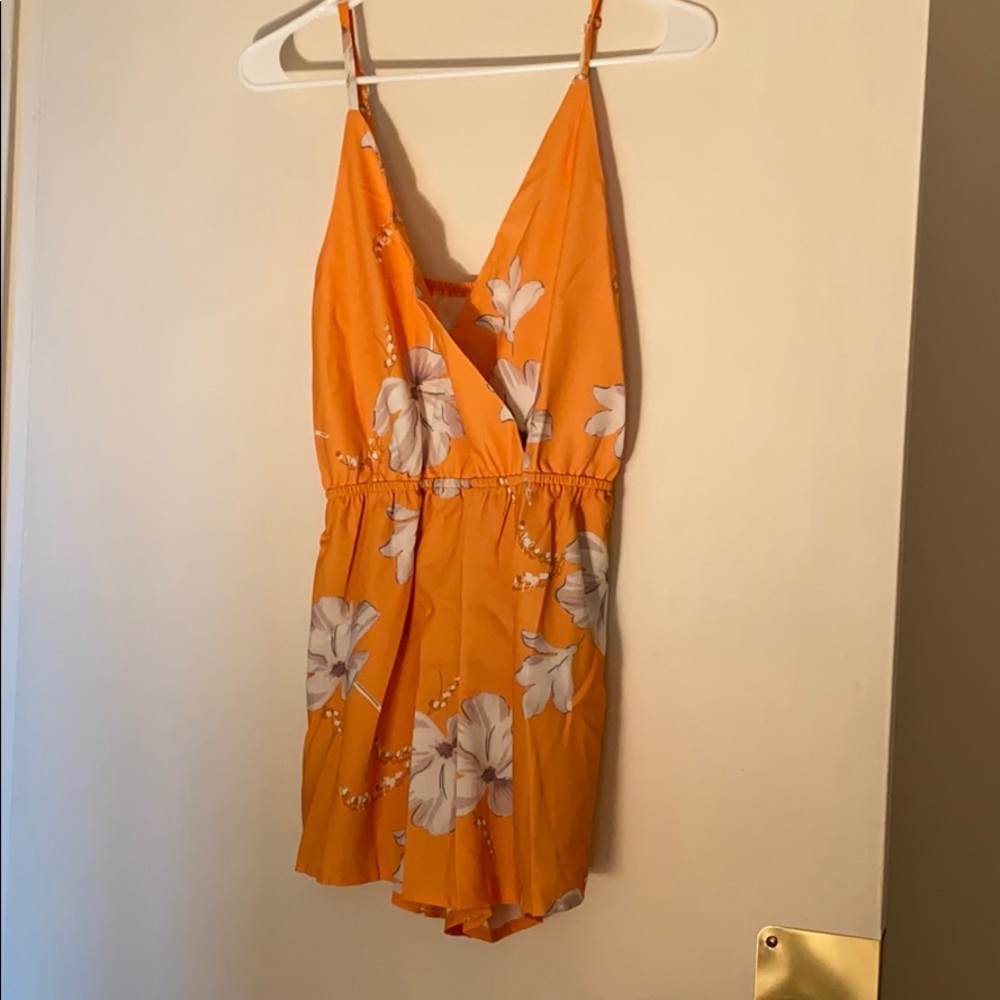 Orange and white floral romper